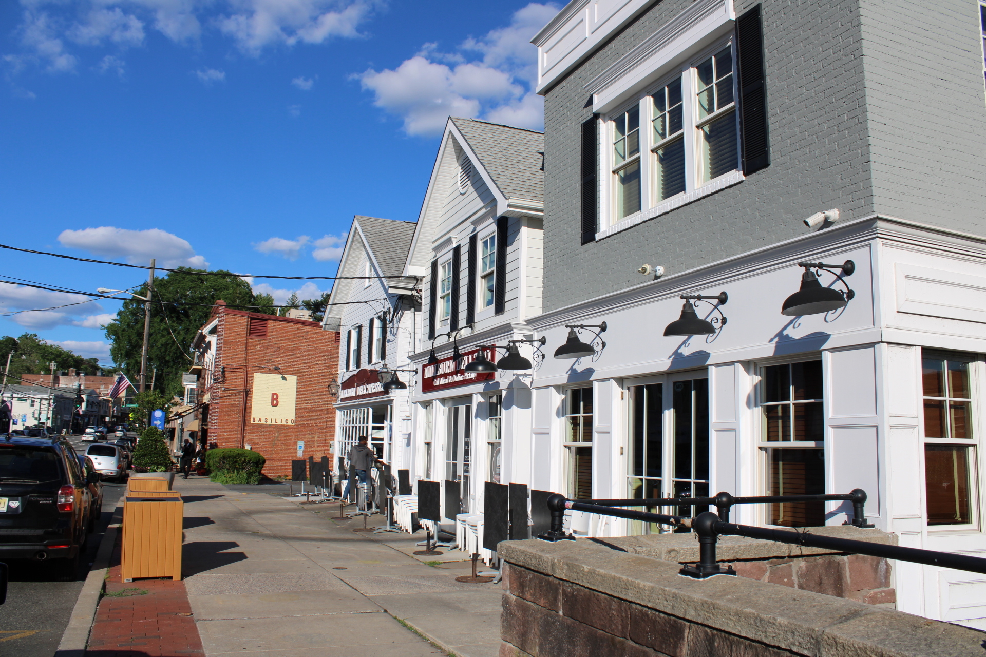 Street view of Downtown Millburn, NJ shops and historic buildings